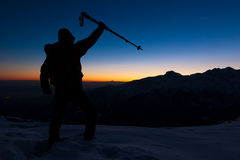 winter-hiking-man-stands-snowy-ridge-looking-sunset-peak-expressing-his-joy-have-reached-top-mountain-peak-36891750